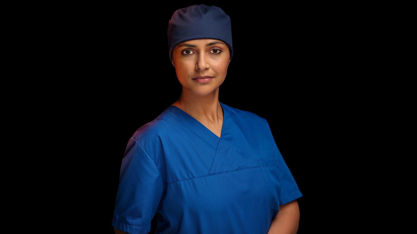 Key visual of a healthcare professional in scrubs
