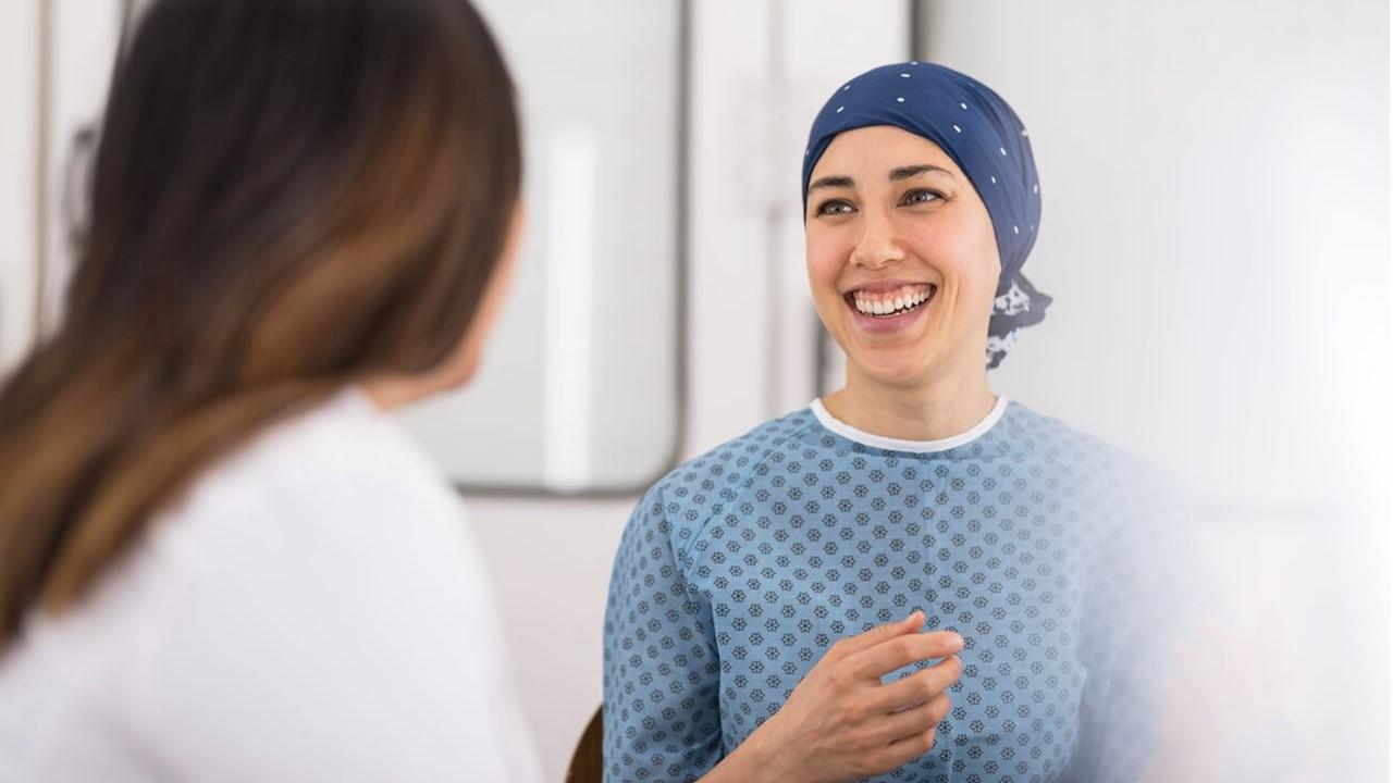 Patient speaking with a healthcare professional during a clinical consultation.