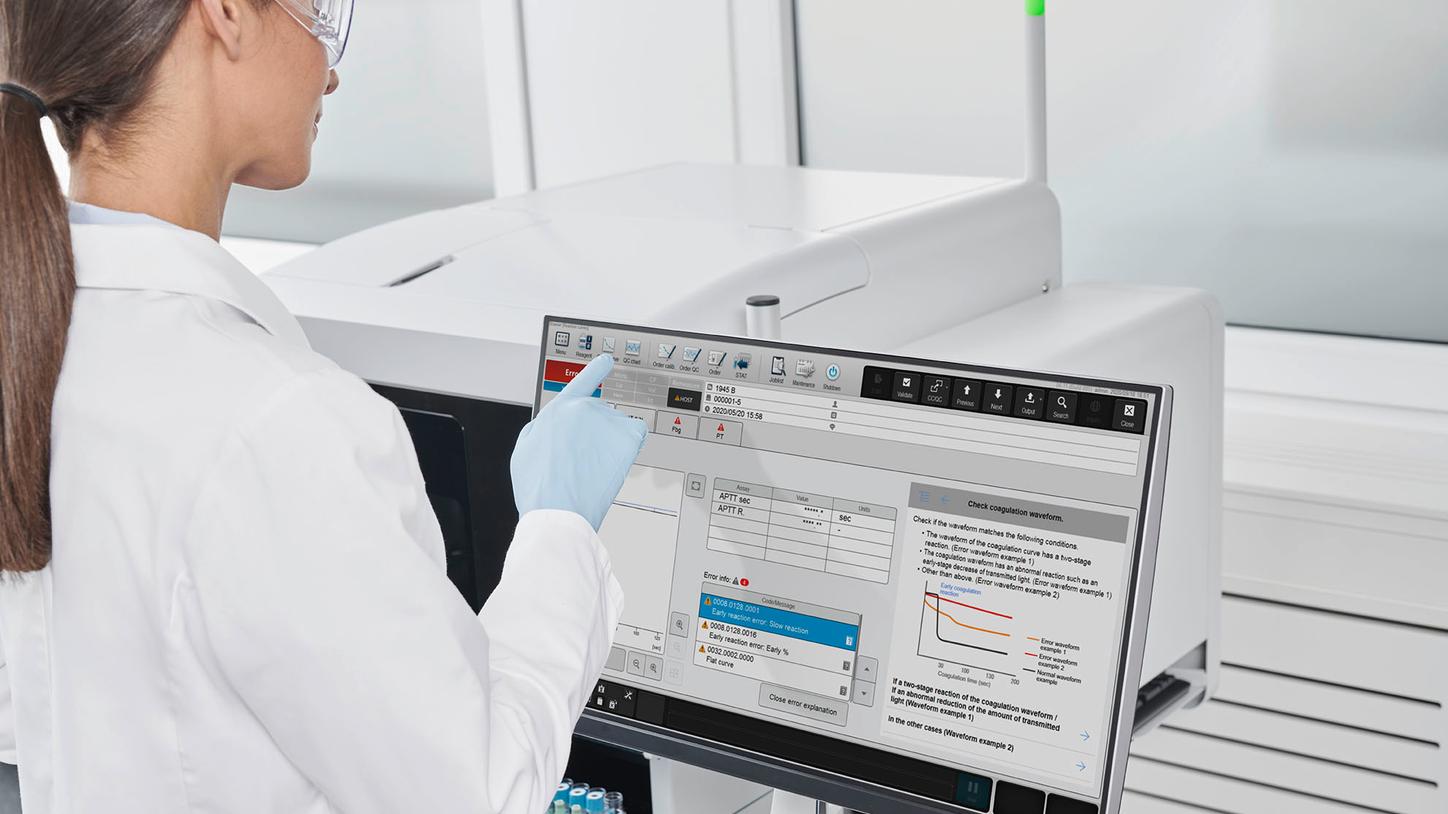 Lab tech operating CN Series System from Siemens Healthineers