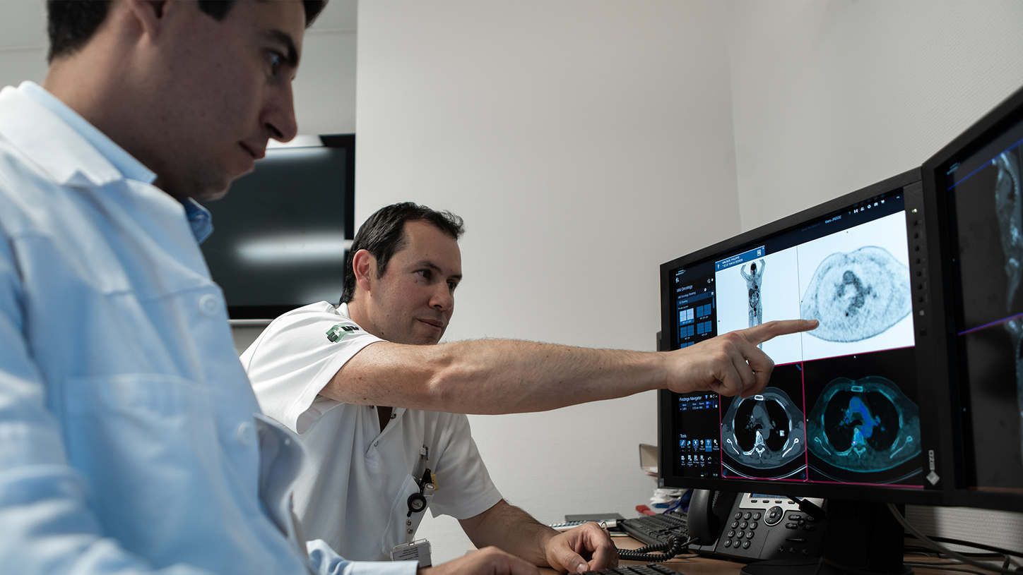 Doctor reviewing scans taken on a Symbia Intevo scanner