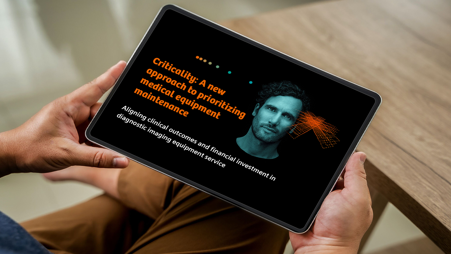 Criticality whitepaper on iPad in man's hands