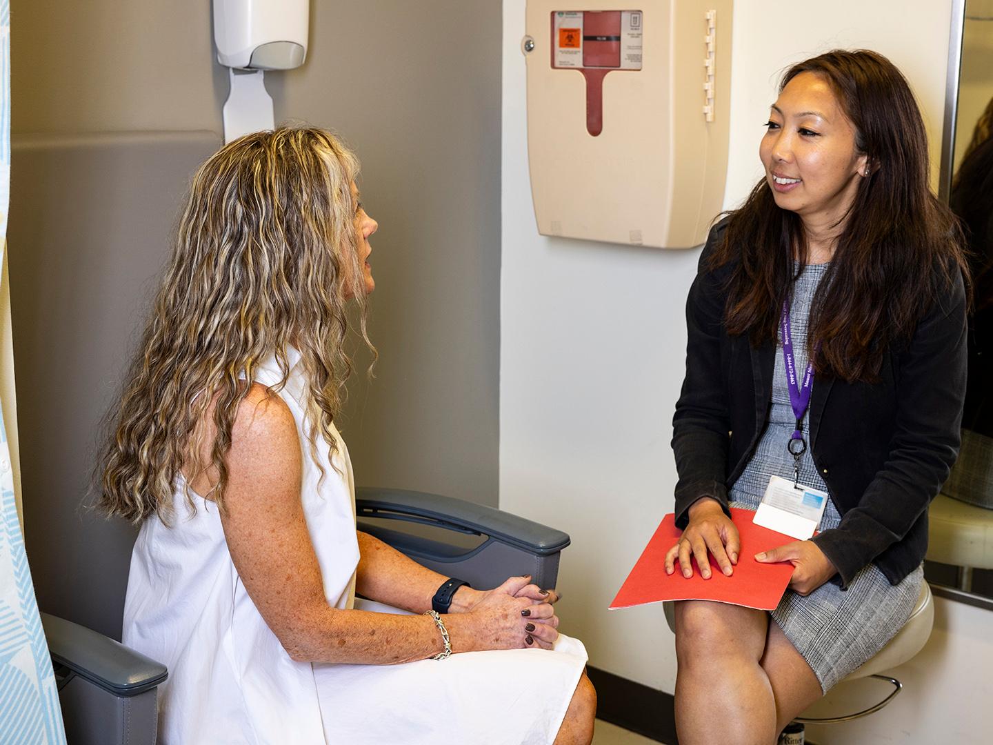 Patient and technician in conversation