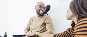 Disabled Black man with his wife by his side