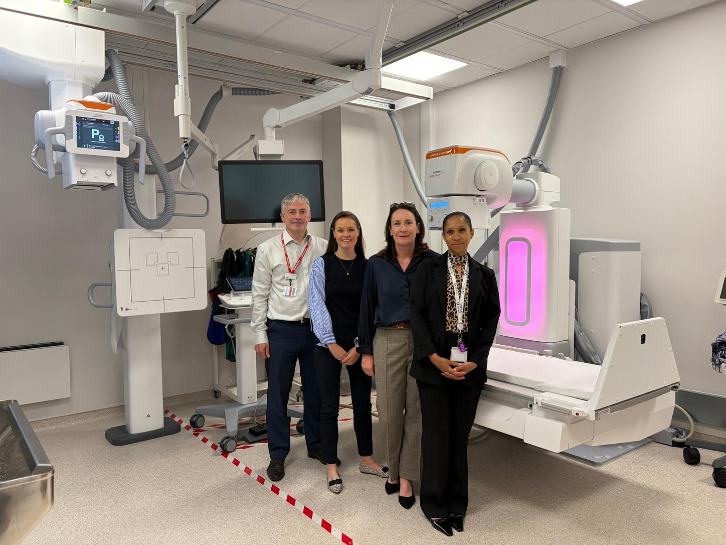 Image caption: [From left to right] Philip Frizzell – regional operations manager at Siemens Healthineers Great Britain and Ireland, Jehane O’Neill – radiology service manager at St. Vincent’s Private Hospital, Edel Murrin – key account manager at Siemens Healthineers Great Britain and Ireland, Charmedene Kleinbooi – radiology service manager in general radiology and PACS at St. Vincent’s Private Hospital, celebrate the installation of Ireland’s first LUMINOS Q.namix R fluoroscopy system. Delivered through a long-term Value Partnership between Siemens Healthineers and St. Vincent’s Private Hospital, the system supports a wide range of examinations while helping improve workflow efficiency, patient positioning and staff safety.