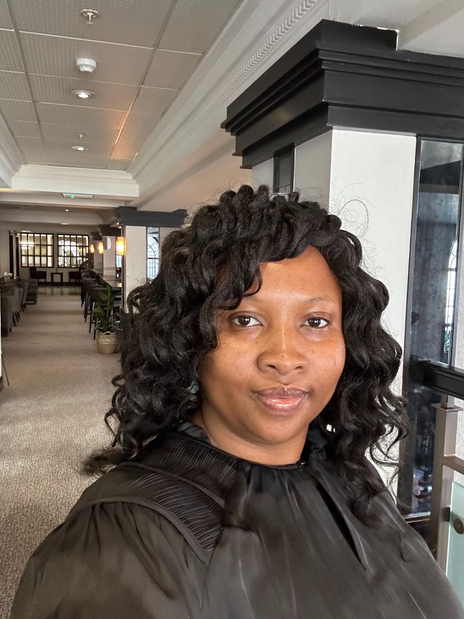 Gwen Musamba in an office building