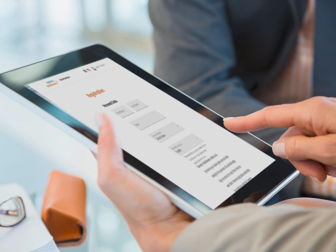 Person using a tablet to access My Siemens Healthineers online services and account information