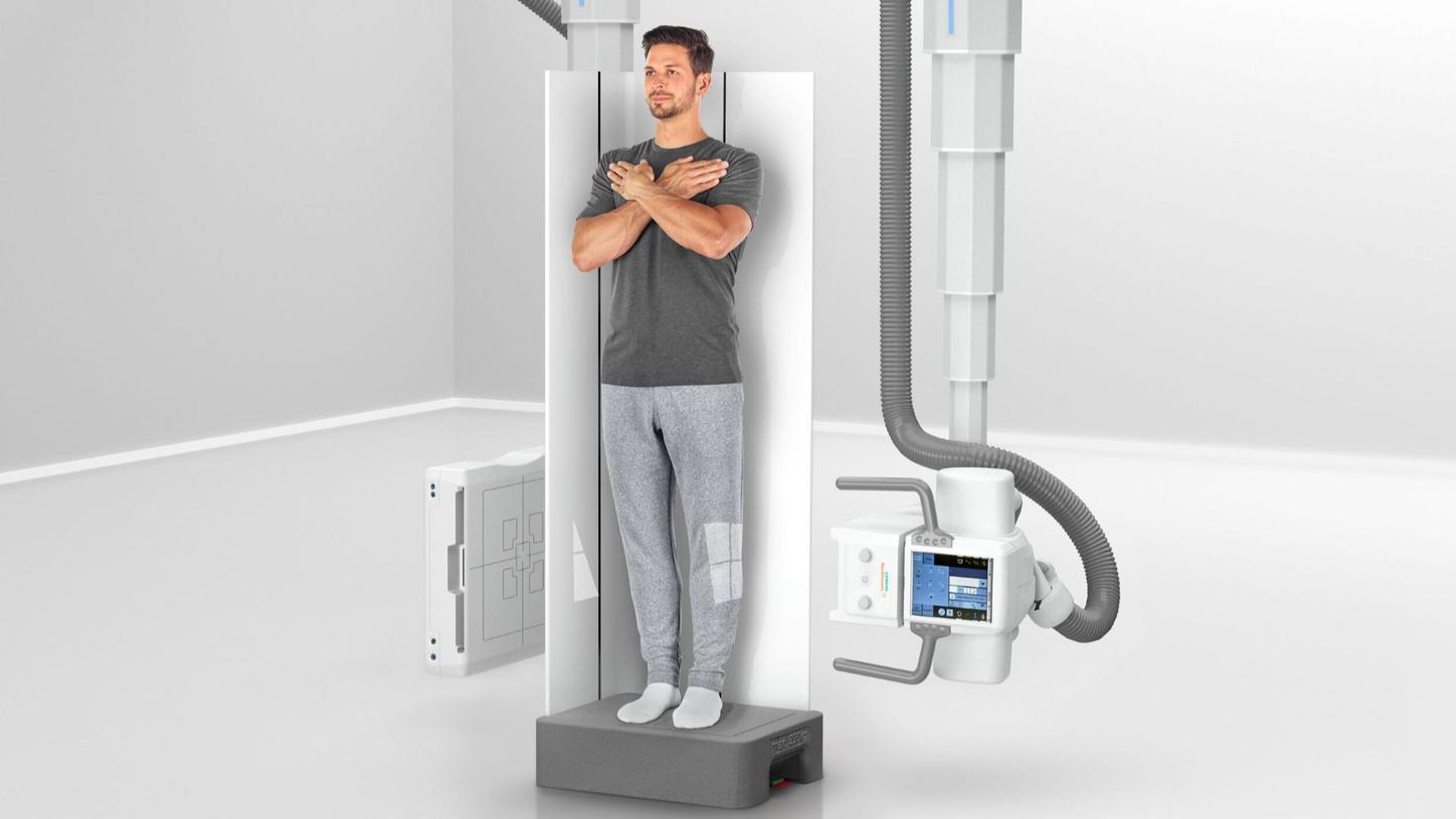 Patient standing on the Multitom Rax