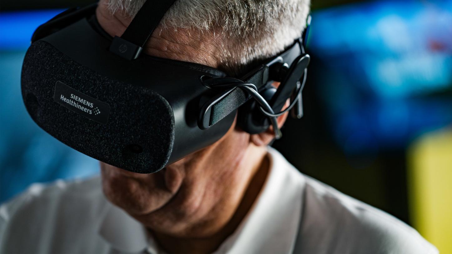 Man wearing a virtual reality headset in a clinical setting.