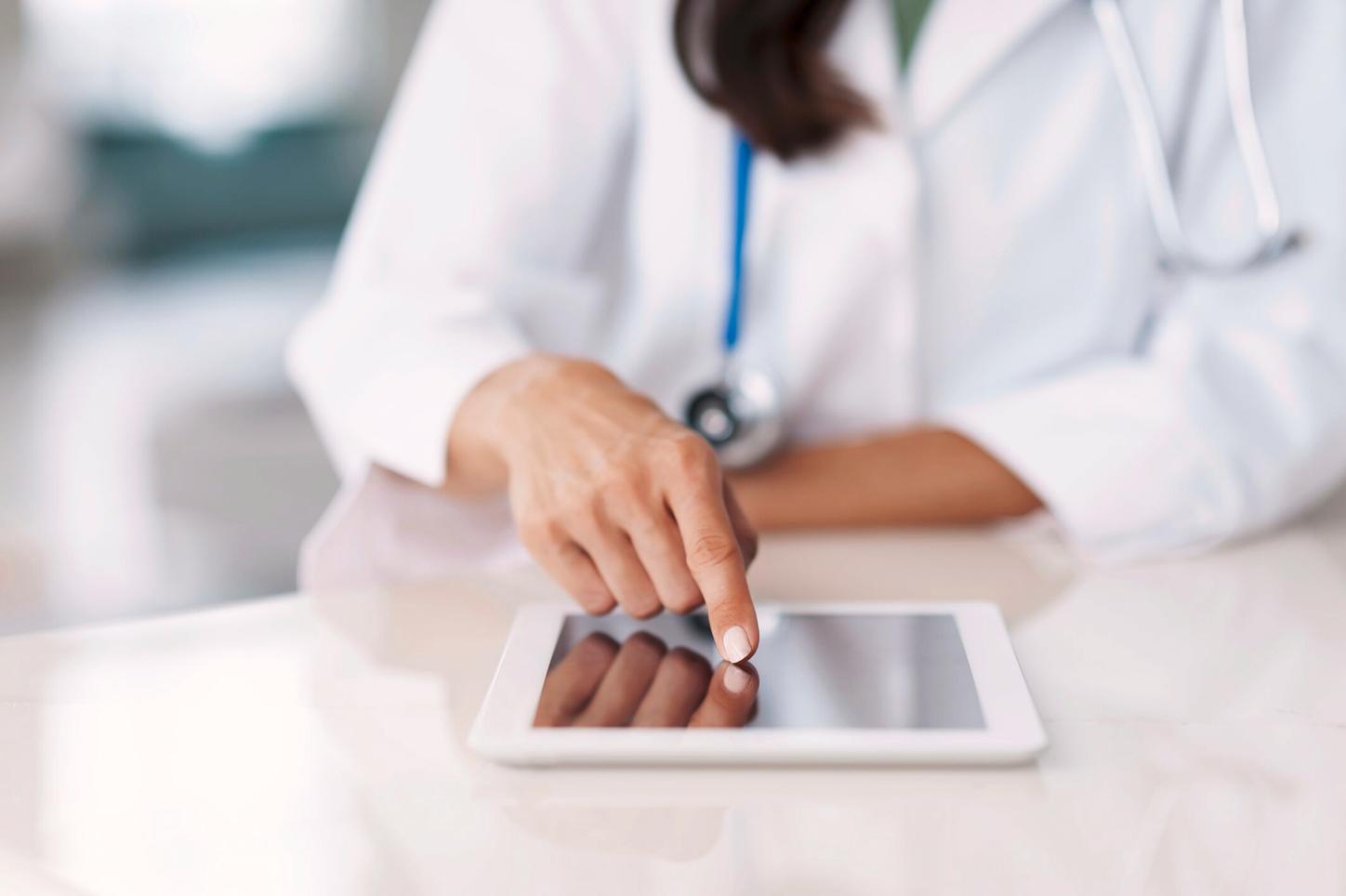 Female doctor using iPad