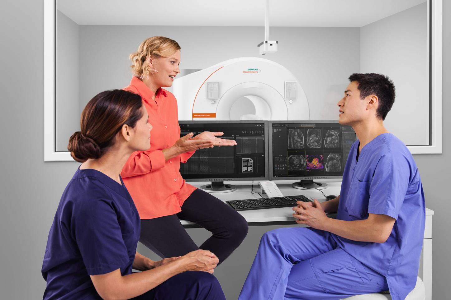 Healthcare professionals having onsite training for an MRI machine