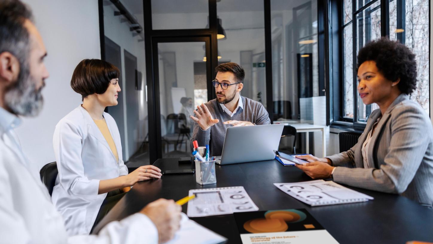 Value partners discussing at a table