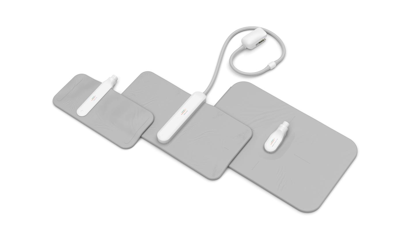 Three flat, rectangular CT detector pads with white connectors, arranged side by side.