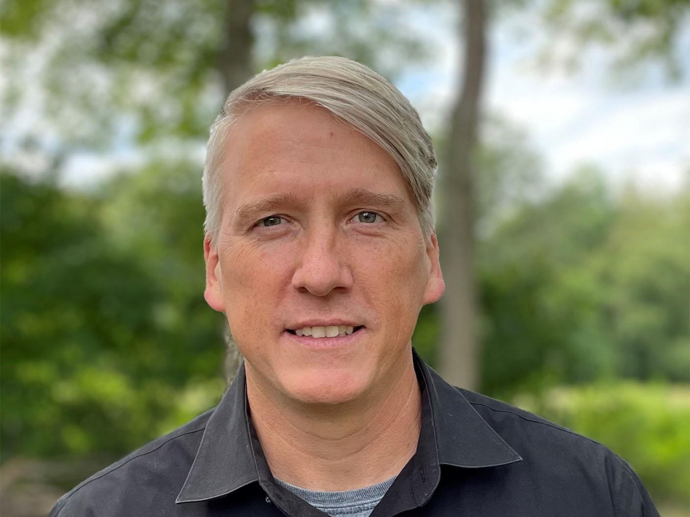 Portrait of Jamie Gramz, Head of Digital Applications, photographed outdoors.