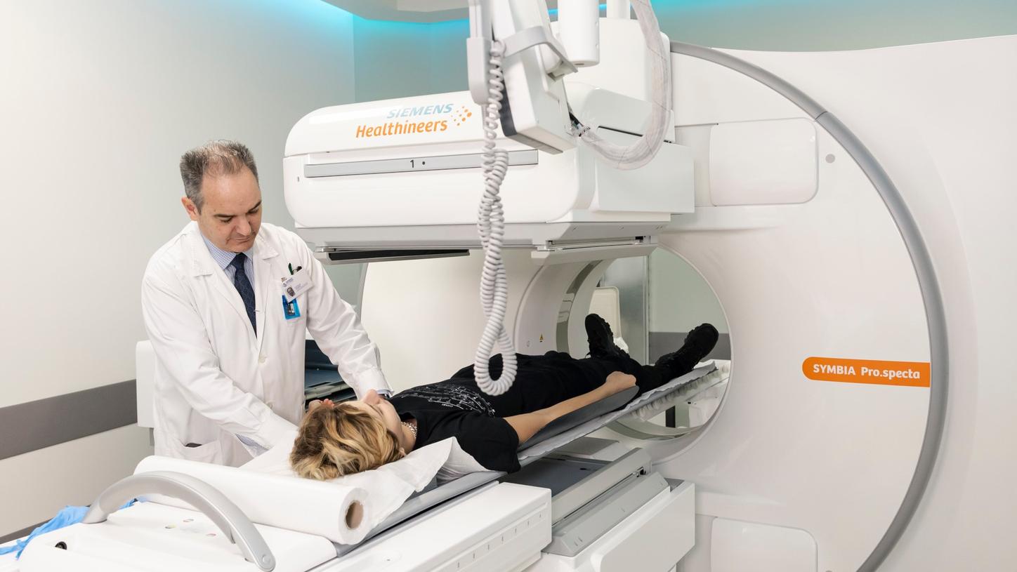 Koutsikos positioning patient on the Symbia Pro.specta SPECT/CT at the Theranostics Nuclear Medicine Center.