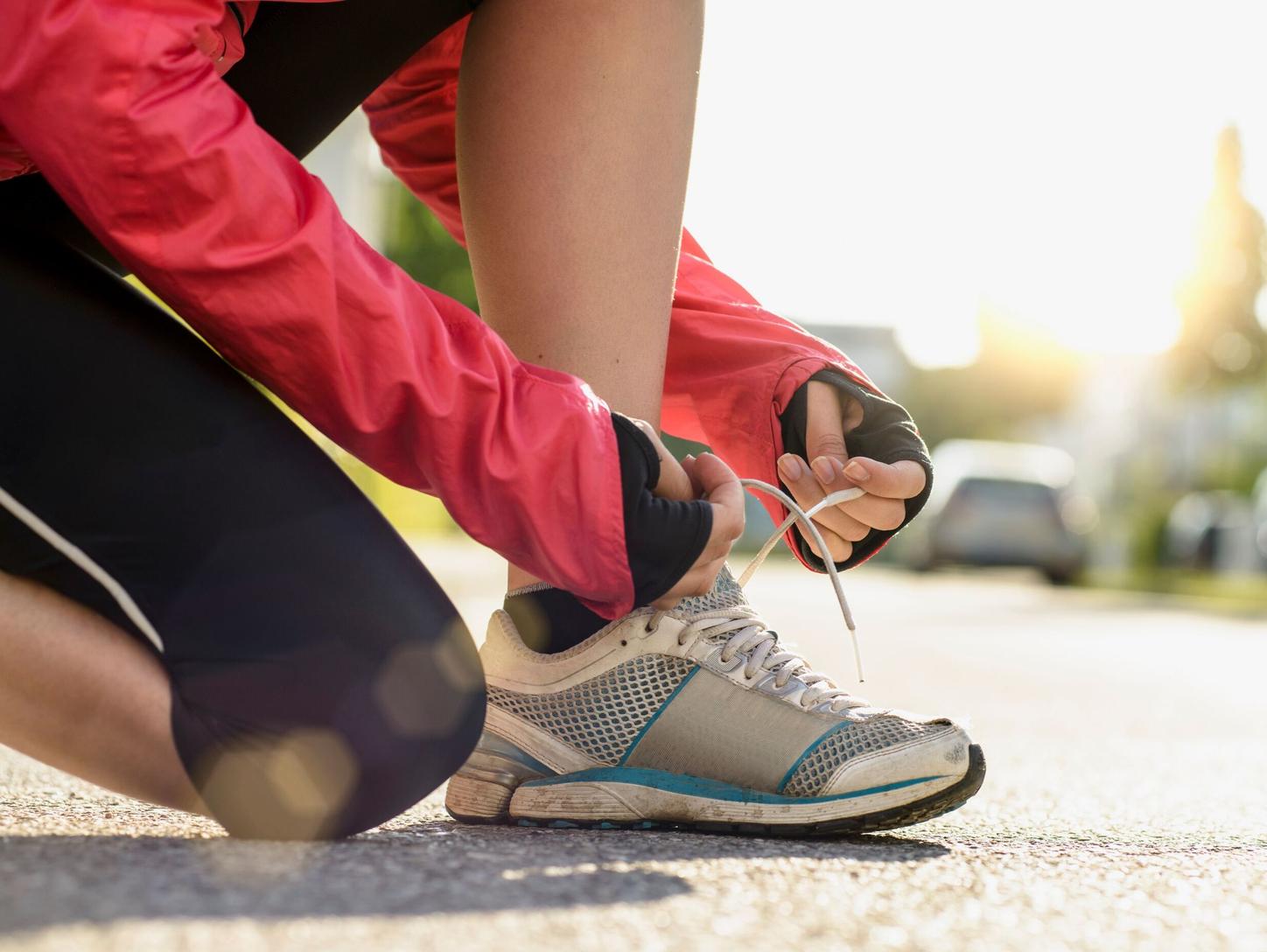 Runner tying shoelaces