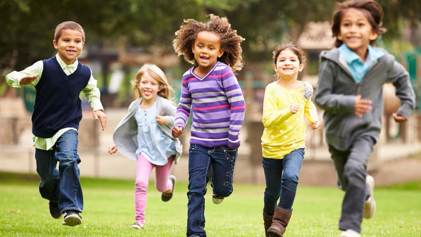 Children running across a field