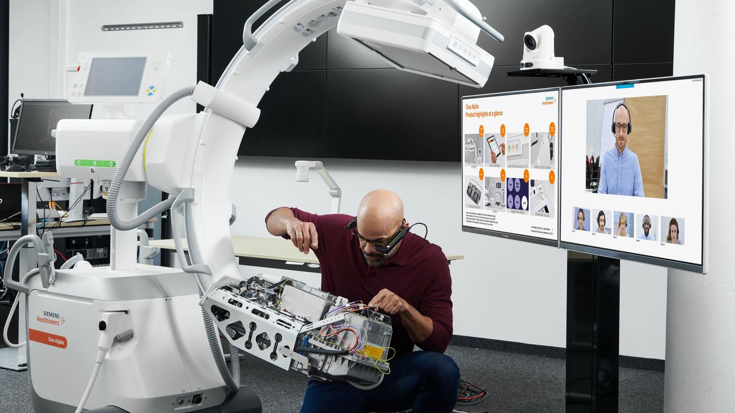 Male engineer demonstrating service on Cios system