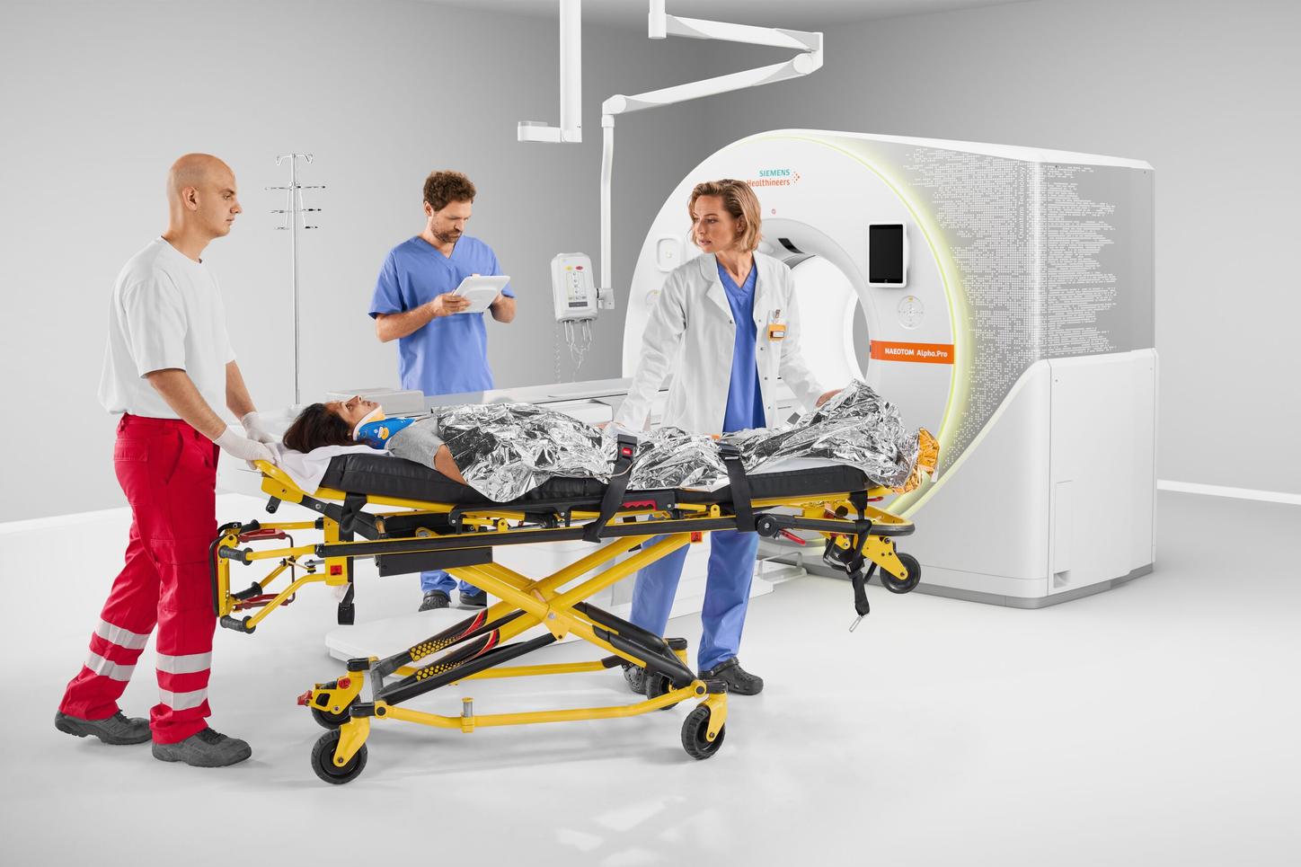 Doctors and patient with the NAEOTOM Alpha.Pro