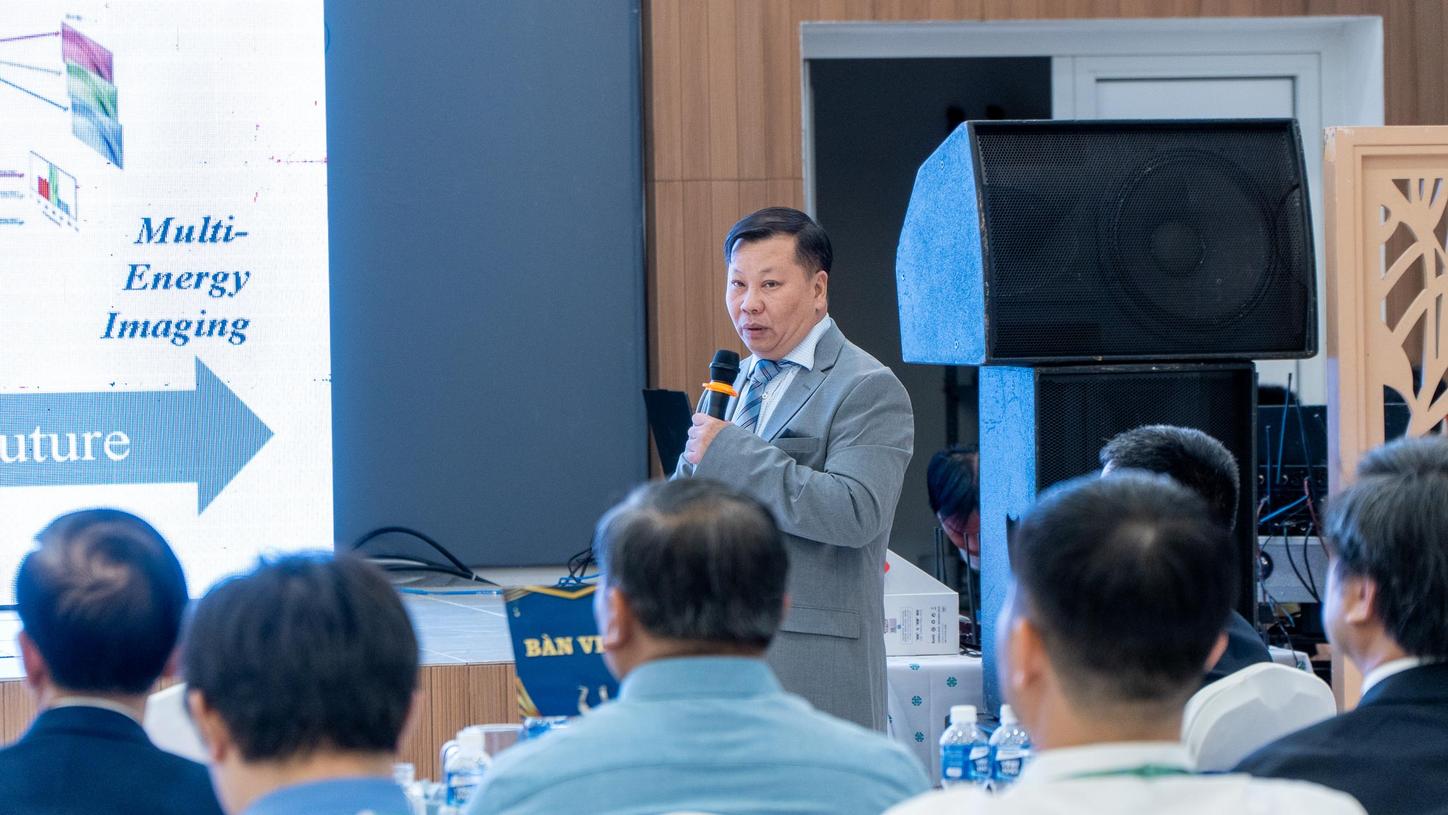 speaker at scientific symposium