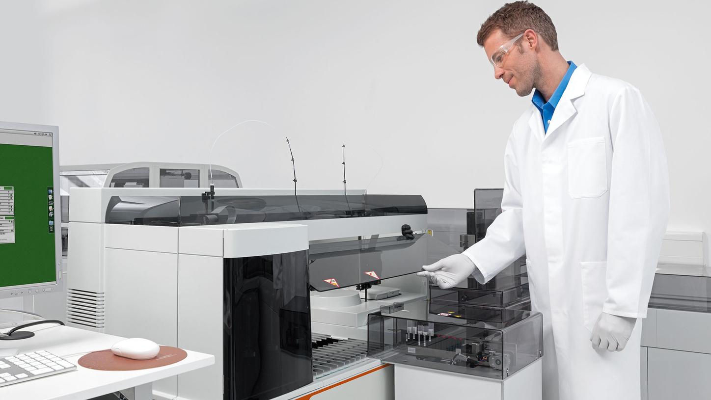 Laboratory professional accessing the BN II System for flexible plasma protein testing automation