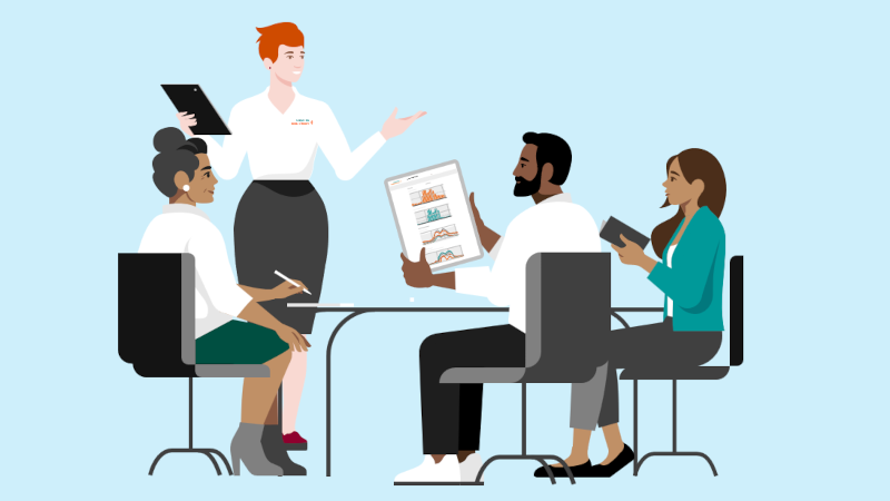 Tailored Solution - Business partners discussing together at one desk