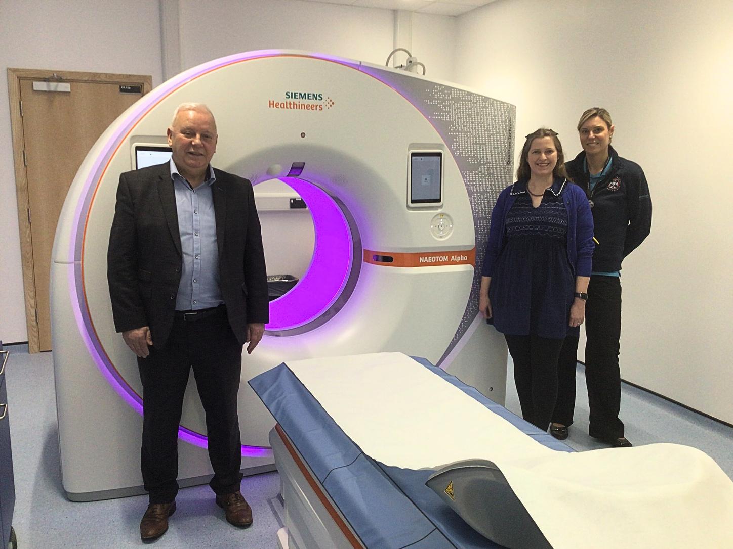 [From left to right]: Brian Kane – regional sales manager at Siemens Healthineers Great Britain and Ireland, Michelle Williams - professor of cardiovascular imaging and Patrycja Grabacz – specialist radiographer at the University of Edinburgh, pictured with the Siemens Healthineers NAEOTOM Alpha, the first photon-counting CT scanner in Scotland. 